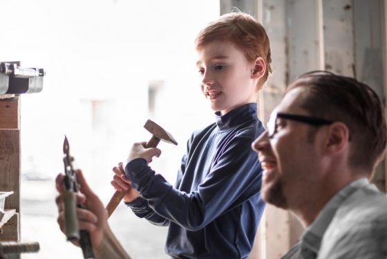 close-up-father-and-son-in-the-home-garage-560x374.jpg